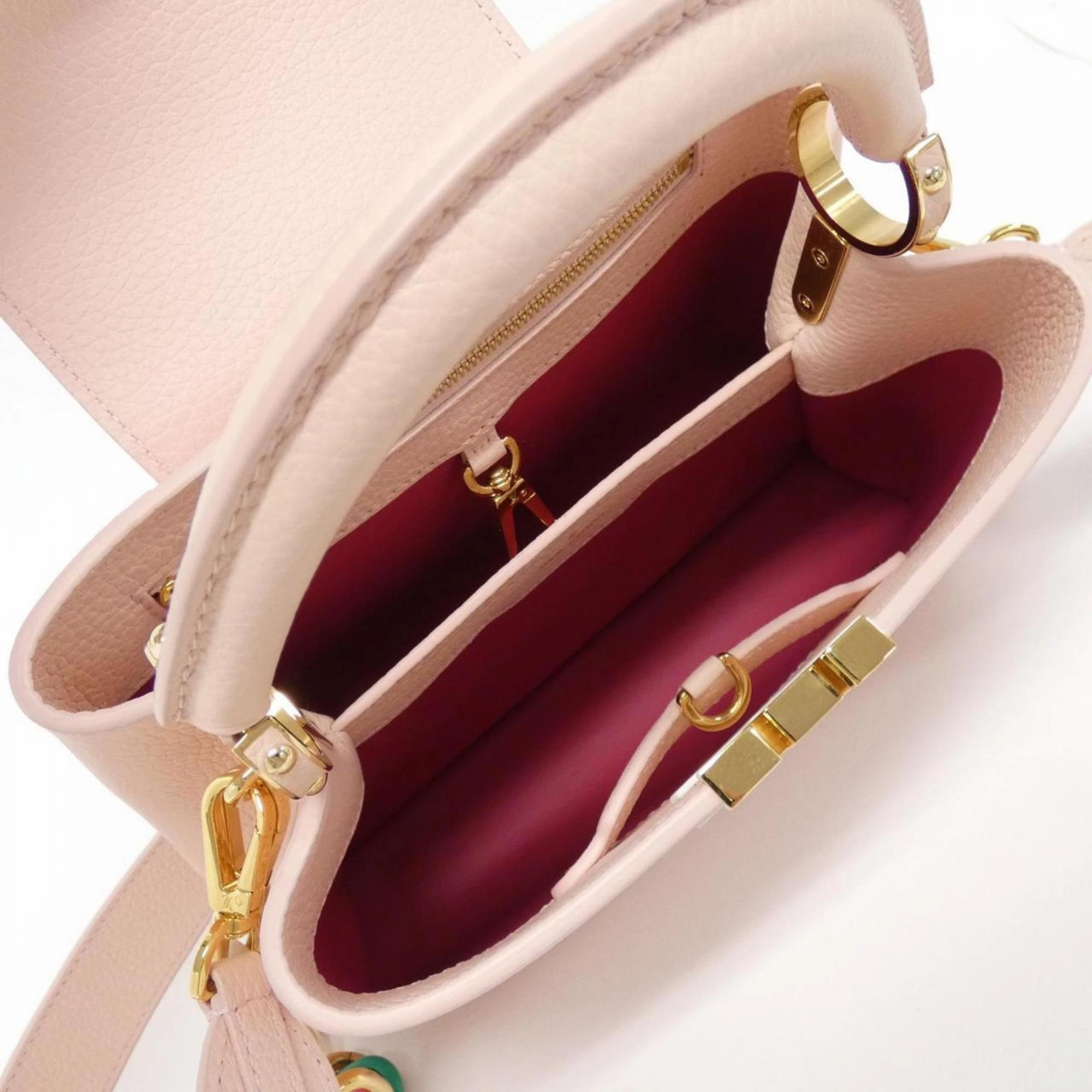 Elegant Capucines Leather Handbag with Dust Bag and Shoulder Strap
