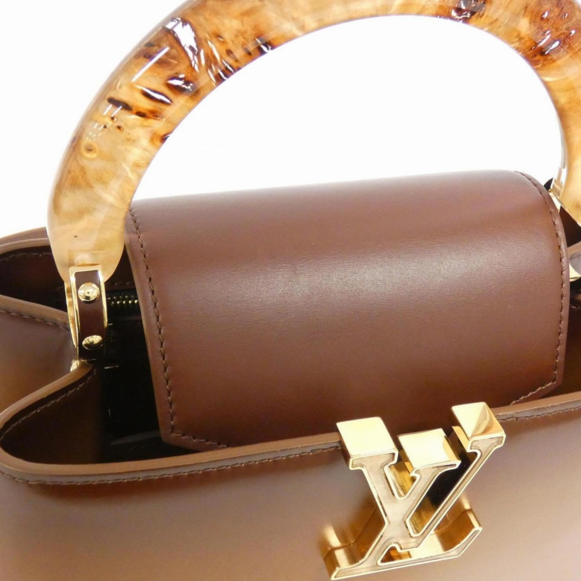 Elegant Leather Handbag with Dust Bag and Shoulder Strap
