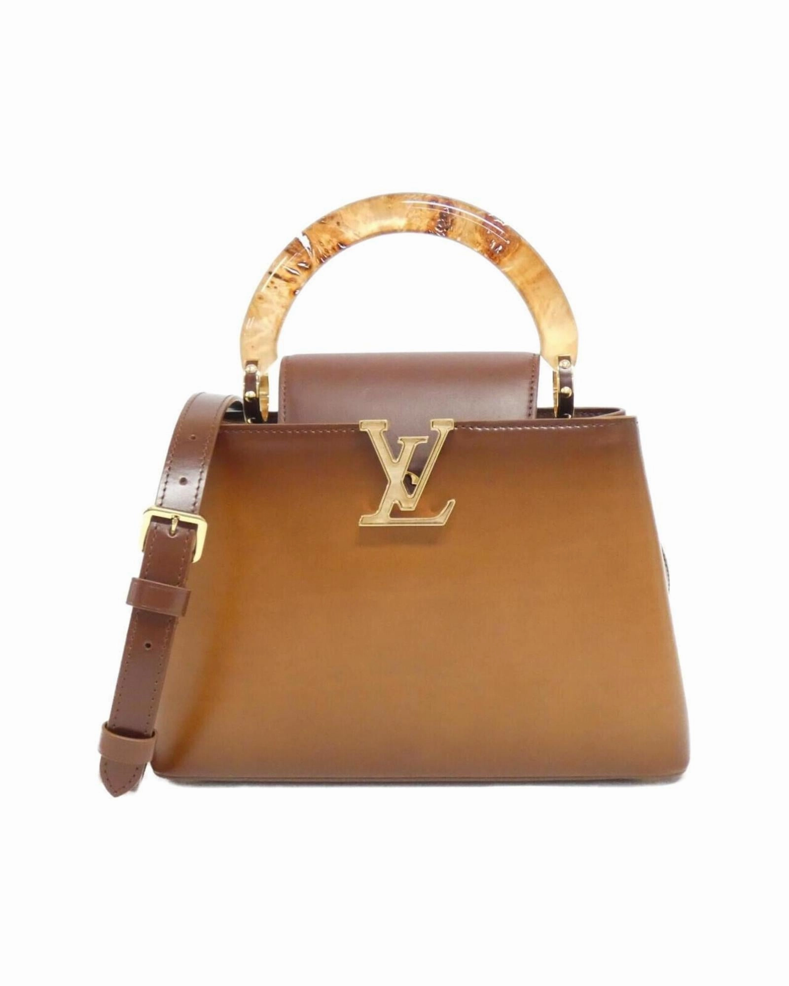 Elegant Leather Handbag with Dust Bag and Shoulder Strap
