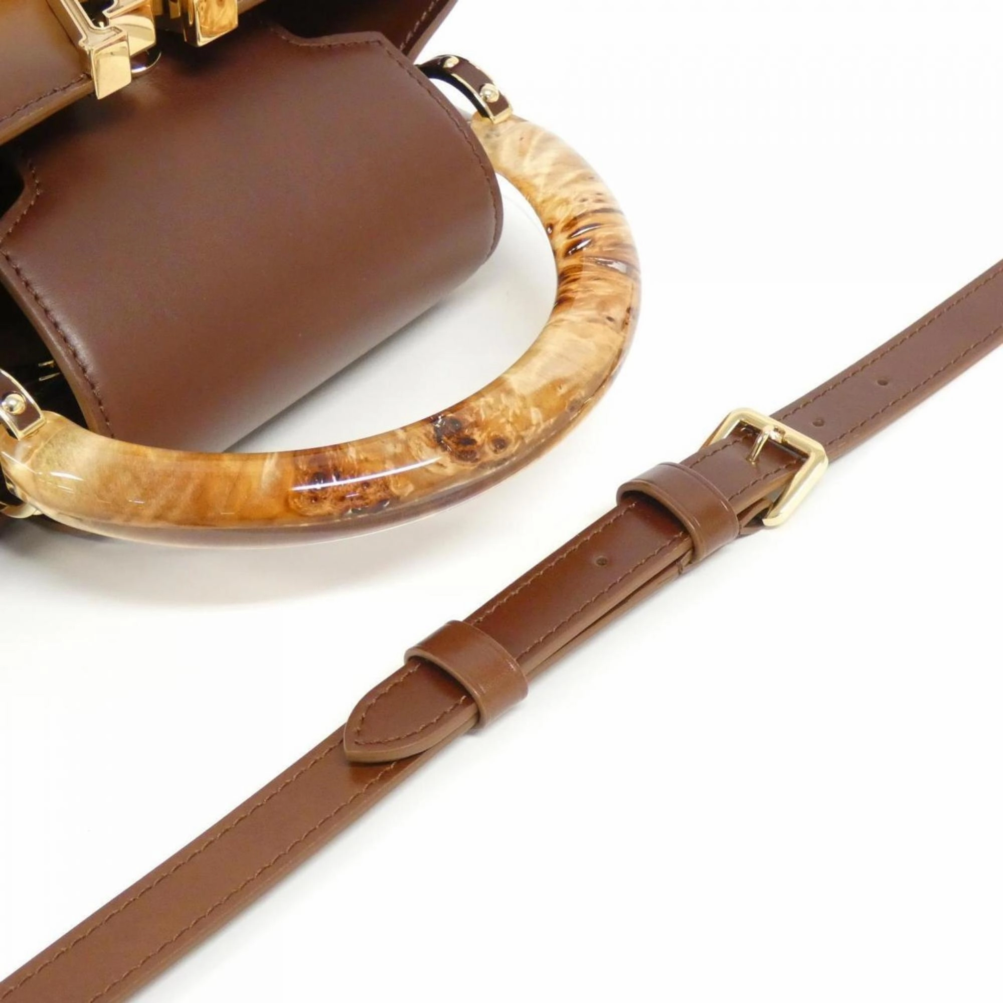 Elegant Leather Handbag with Dust Bag and Shoulder Strap