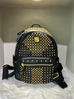 Pre-loved MCM Stark Black Backpack with Gold Studs