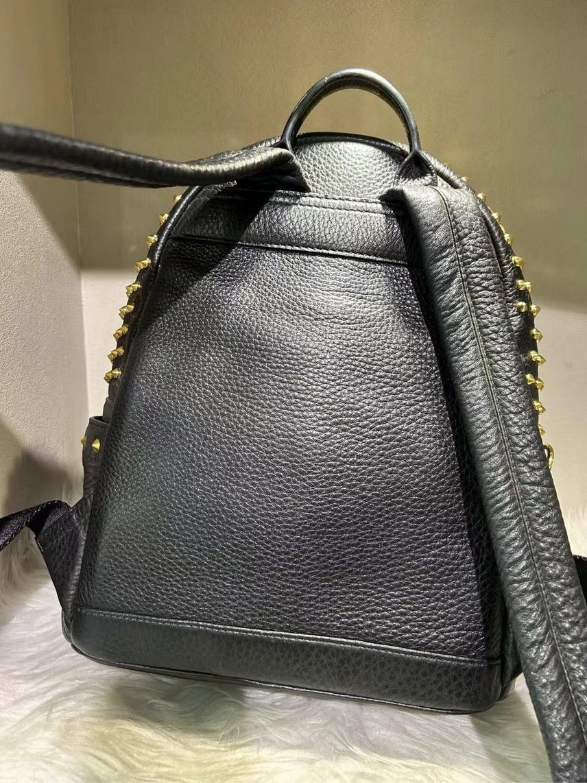 Pre-loved MCM Stark Black Backpack with Gold Studs