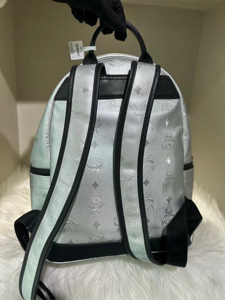 Pre-Loved MCM Stark Silver Backpack with Signature Logo Pattern and Black Accents